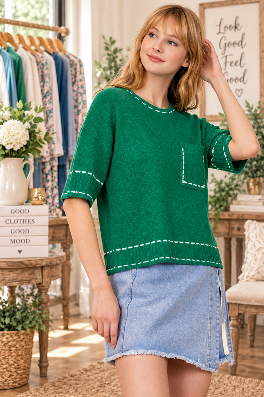 VERY J stitch detail knit sweater top with round neckline, short sleeves, patch pocket, and ribbed hem side view