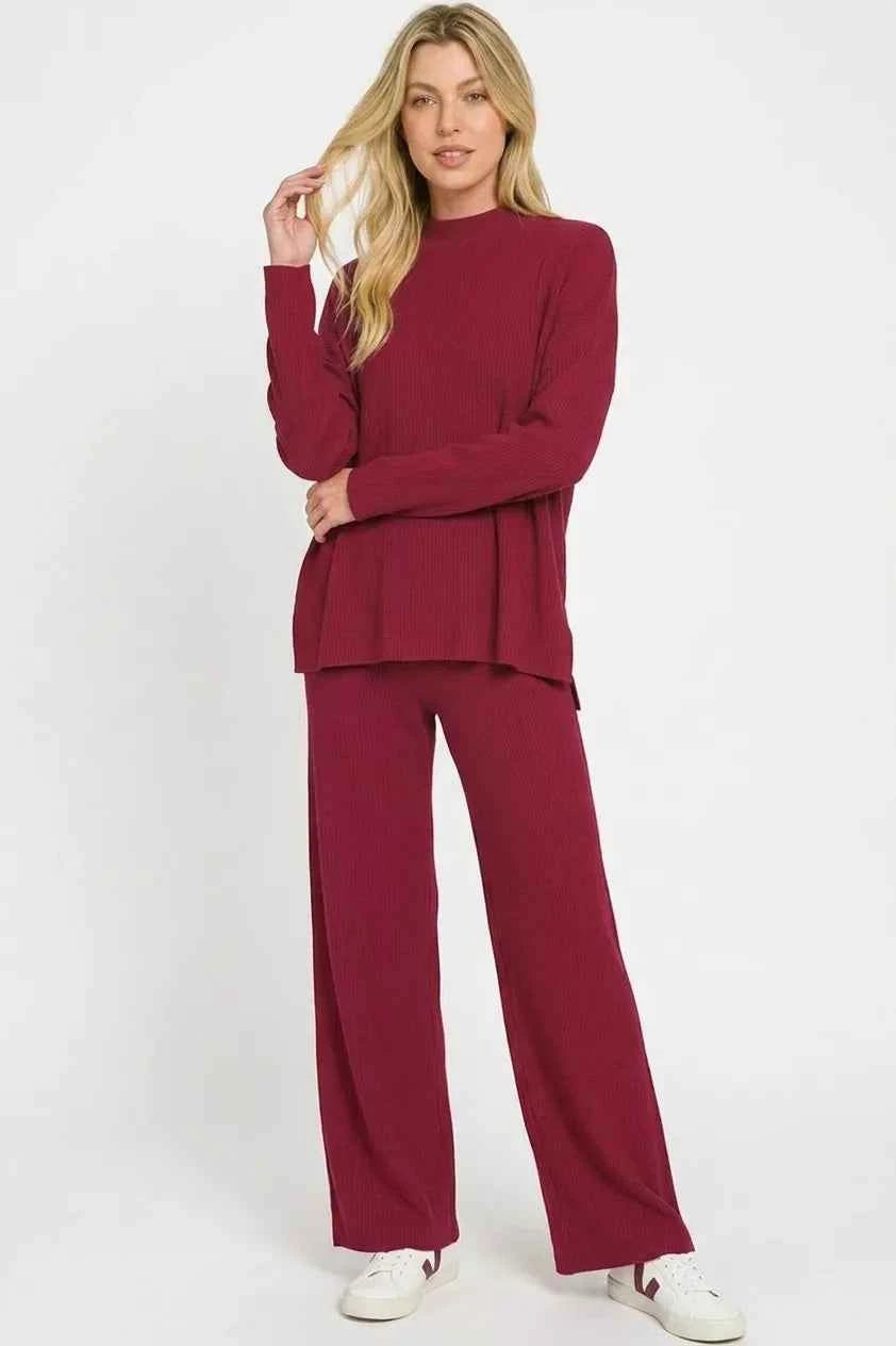 Woman wearing a Cabernet ribbed viscose two-piece lounge set featuring a relaxed sweater top and wide-leg pants by Zenana. front view 2