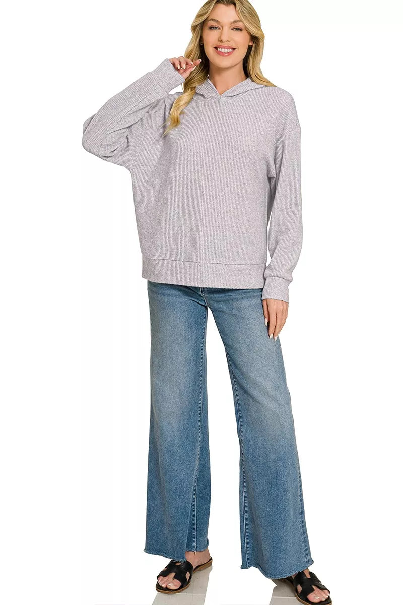 Woman wearing a Heather Grey brushed ribbed hacci knit hoodie with long sleeves and a relaxed fit by Zenana. Full View