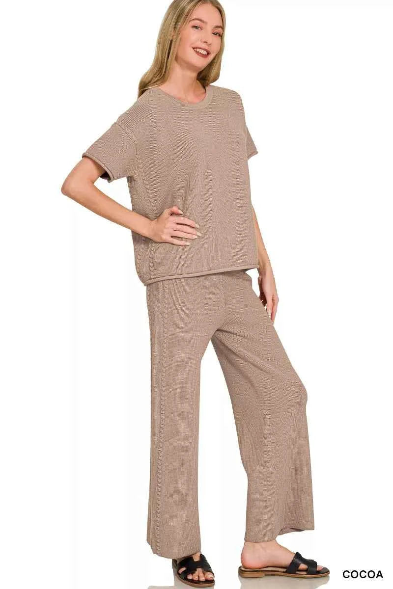 Woman wearing a Zenana cocoa ribbed knit two-piece lounge set featuring a relaxed short-sleeve top and matching wide-leg pants. Side View