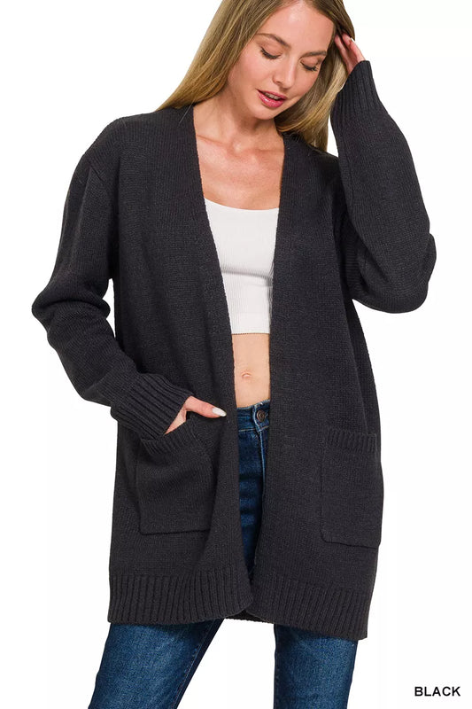 Woman wearing a black open front ribbed knit cardigan sweater with front pockets by Zenana. Front View 2