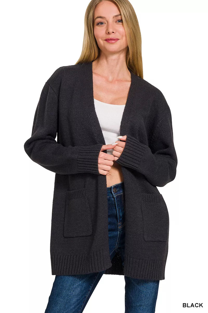 Woman wearing a black open front ribbed knit cardigan sweater with front pockets by Zenana. Front View 3