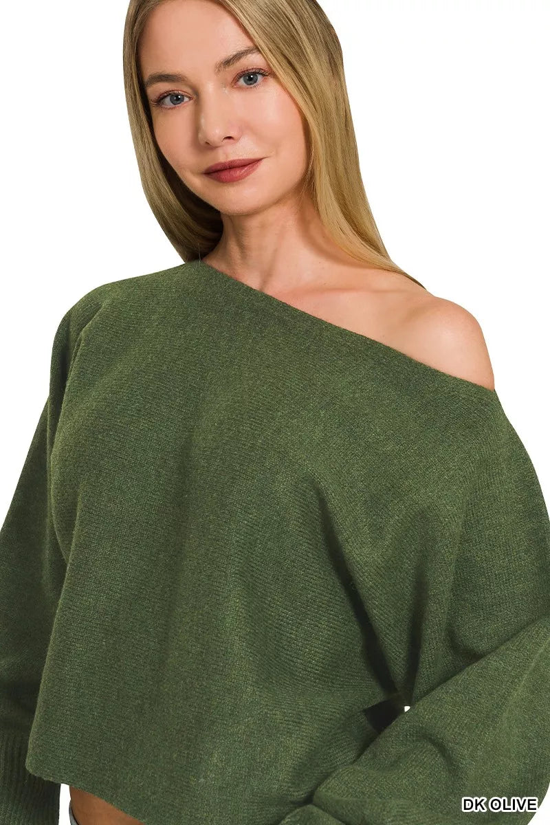 Woman wearing Zenana Dark Olive Boat Neck Balloon Sleeve Sweater with oversized fit and ribbed cuffs paired with denim jeans.