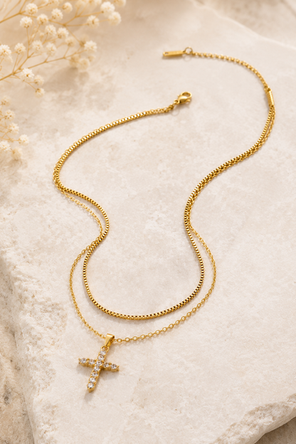 18K gold layered stainless steel necklace featuring a sparkling crystal cross pendant on delicate double chains.