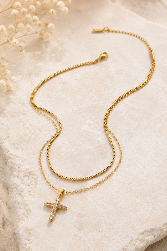 18K gold layered stainless steel necklace featuring a sparkling crystal cross pendant on delicate double chains.