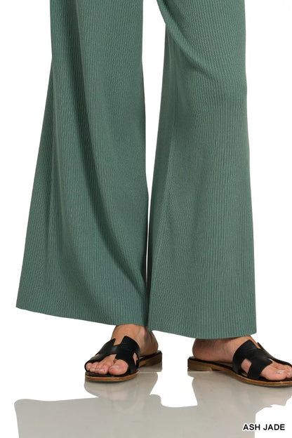 Woman wearing an Ash Jade ribbed two-piece sweater and wide leg pants set by Zenana featuring a relaxed fit and soft viscose knit fabric.
