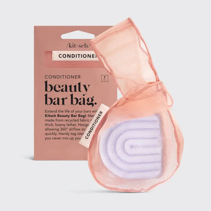 Kitsch beauty bar bag with a conditioner bar and packaging on a light gray background
