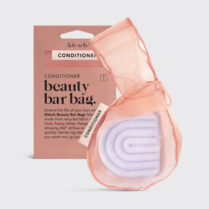 Kitsch beauty bar bag with a conditioner bar and packaging on a light gray background