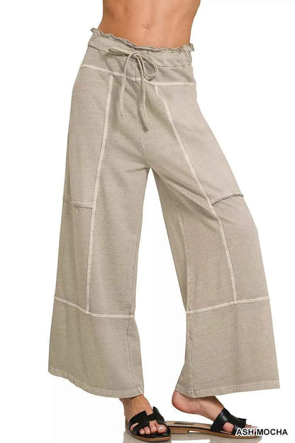 Woman wearing ash mocha washed French terry wide leg pants with exposed seam details, drawstring waist, and relaxed casual fit by Zenana.