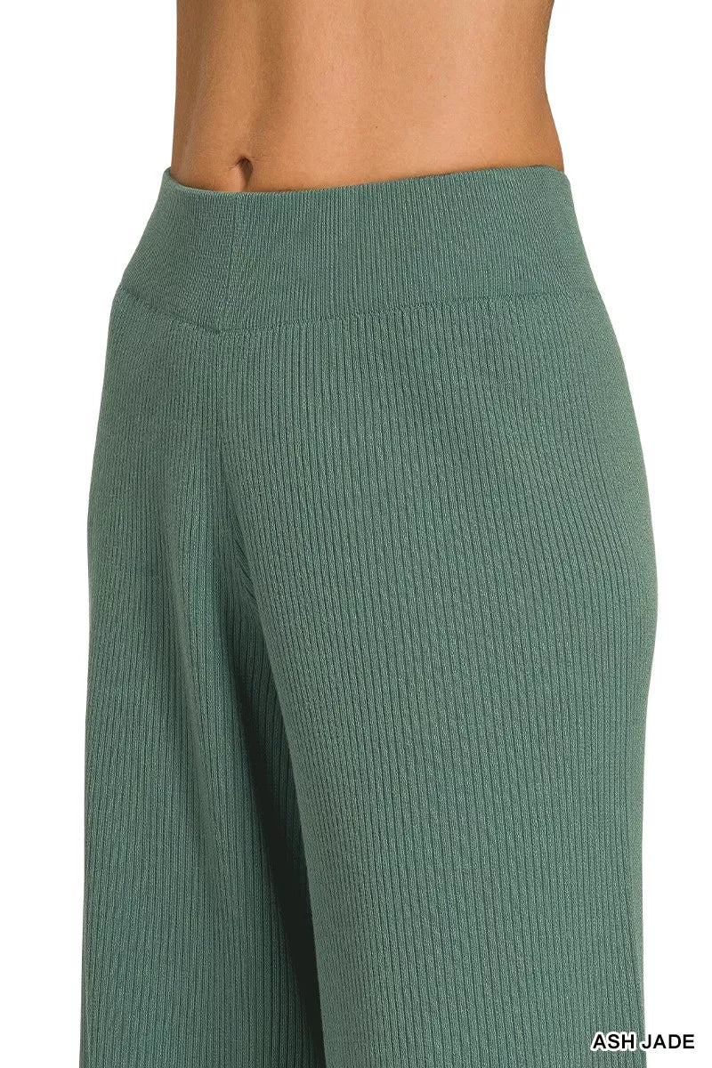 Woman wearing an Ash Jade ribbed two-piece sweater and wide leg pants set by Zenana featuring a relaxed fit and soft viscose knit fabric.