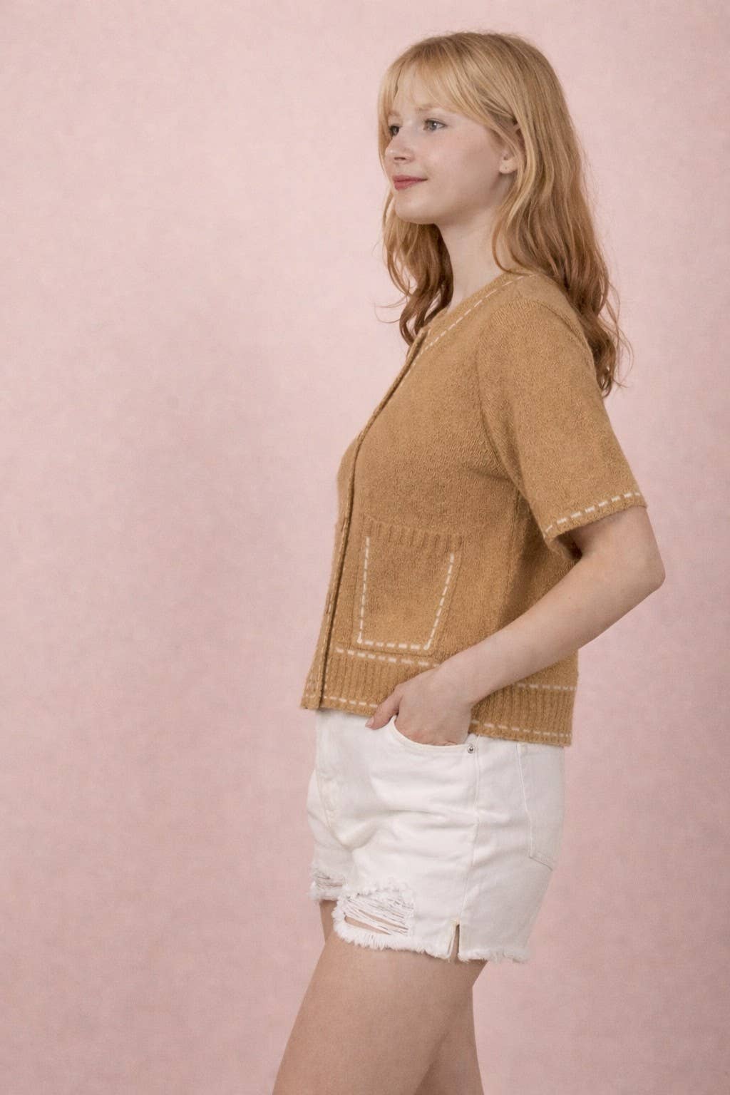Stitch detail button-down knit cardigan top with short sleeves, front pockets, ribbed hem, and round neckline