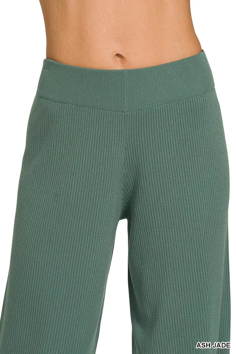Woman wearing an Ash Jade ribbed two-piece sweater and wide leg pants set by Zenana featuring a relaxed fit and soft viscose knit fabric.