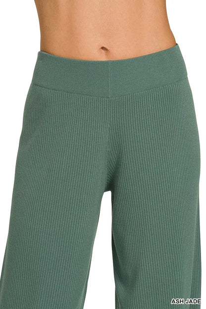 Woman wearing an Ash Jade ribbed two-piece sweater and wide leg pants set by Zenana featuring a relaxed fit and soft viscose knit fabric.