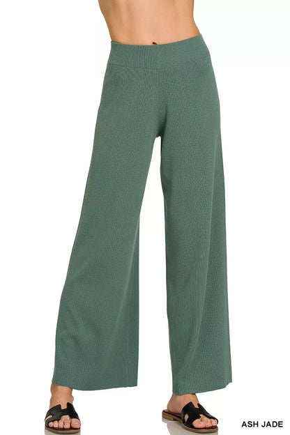 Woman wearing an Ash Jade ribbed two-piece sweater and wide leg pants set by Zenana featuring a relaxed fit and soft viscose knit fabric.