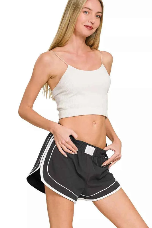 Black Soft Woven Lined Dolphin Shorts by Zenana