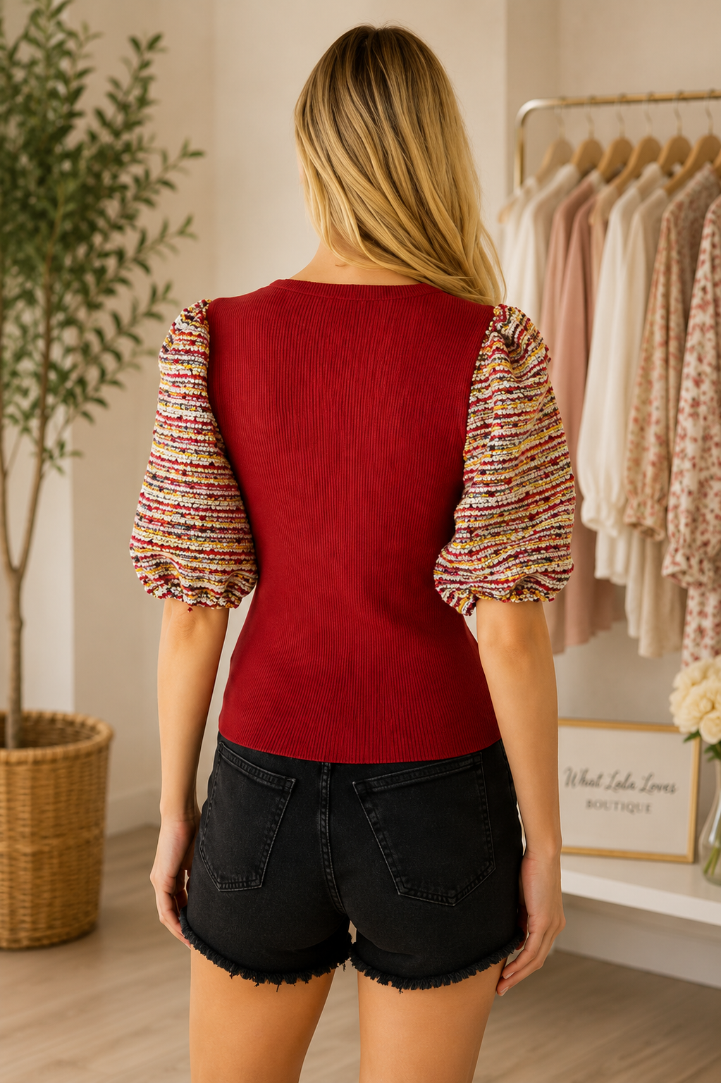 Burgundy knit top with multicolor tweed puff sleeves by Voy back view
