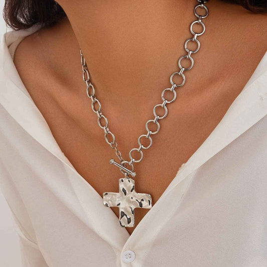 Hammered cross toggle chain necklace with oversized link chain available in gold and silver. On Model