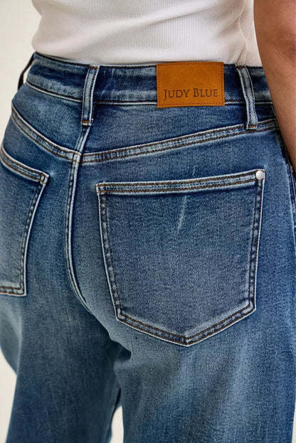 Judy Blue High Waist Marlow Arc Jeans in weathered indigo wash with relaxed arc-leg silhouette and high-rise waist. close view