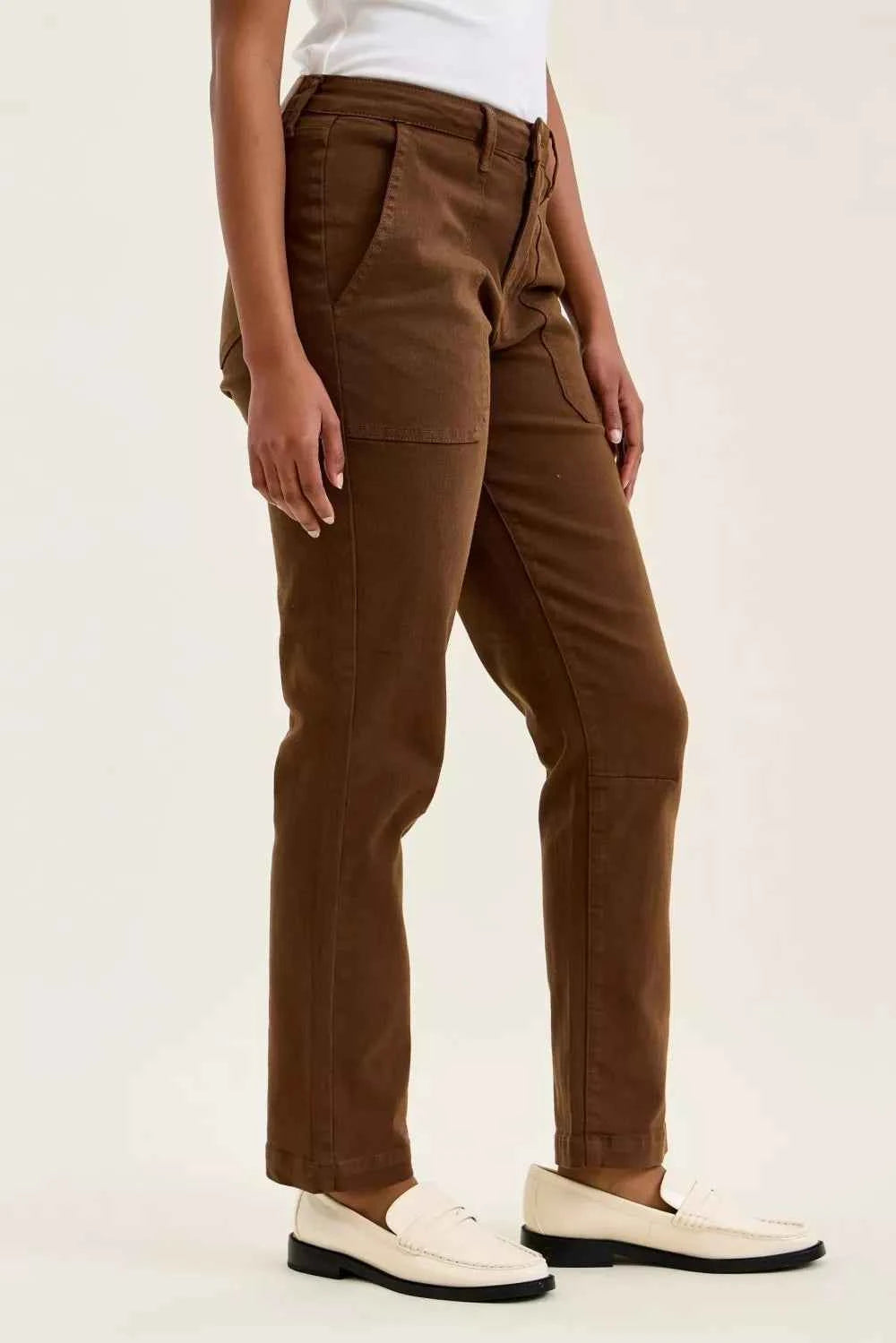 Model wearing Judy Blue Aurora Weekender high waist mahogany jeans with knee dart detailing and ankle-length silhouette. Side View