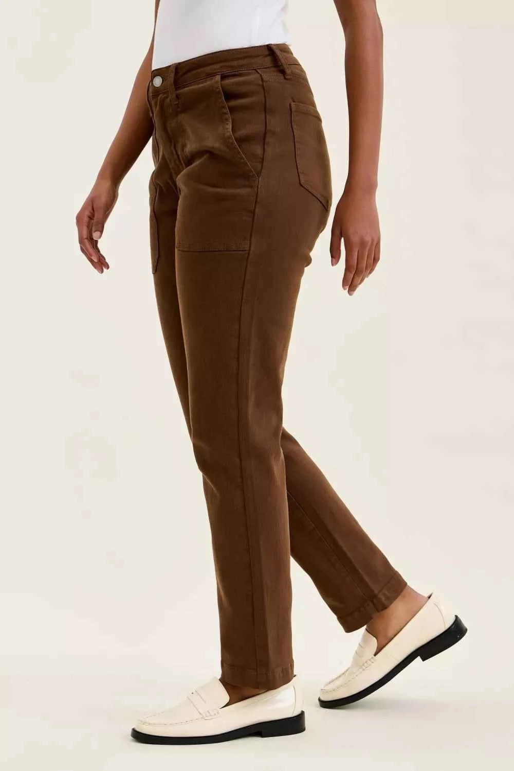 Model wearing Judy Blue Aurora Weekender high waist mahogany jeans with knee dart detailing and ankle-length silhouette. Side View 2
