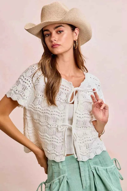 Shop the Ivory Pointelle Front Bow Tie Knit Top by BiBi. Lightweight pointelle knit with feminine bow details for effortless layering and everyday style. Front View 3