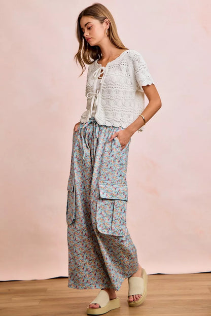 Shop the Ivory Pointelle Front Bow Tie Knit Top by BiBi. Lightweight pointelle knit with feminine bow details for effortless layering and everyday style. Full view