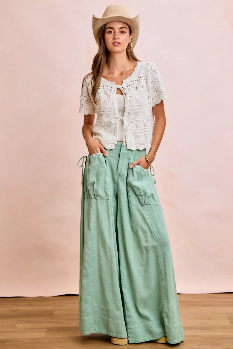 Shop the Ivory Pointelle Front Bow Tie Knit Top by BiBi. Lightweight pointelle knit with feminine bow details for effortless layering and everyday style. Full view 2