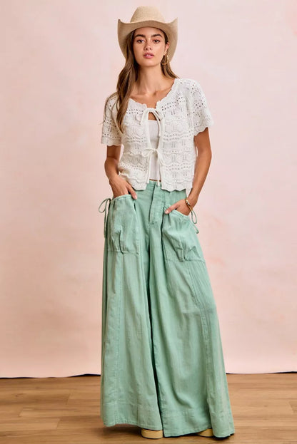 Shop the Ivory Pointelle Front Bow Tie Knit Top by BiBi. Lightweight pointelle knit with feminine bow details for effortless layering and everyday style. Full view 2