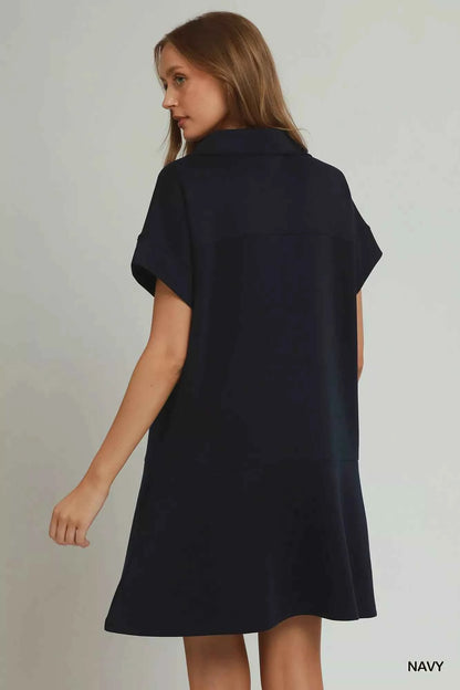Umgee navy CloudKnit quarter zip mini dress with collar, relaxed fit, side pockets, and soft modal blend fabric styled with casual sneakers. Back View