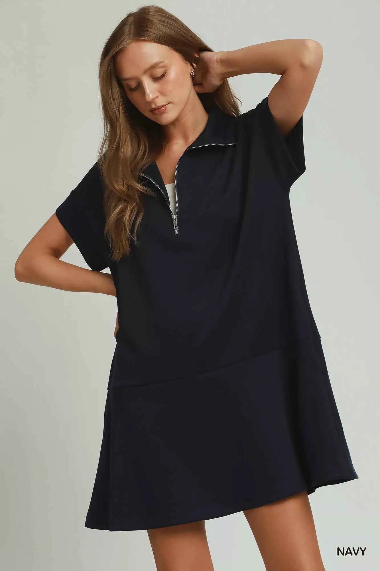 Umgee navy CloudKnit quarter zip mini dress with collar, relaxed fit, side pockets, and soft modal blend fabric styled with casual sneakers. Front View