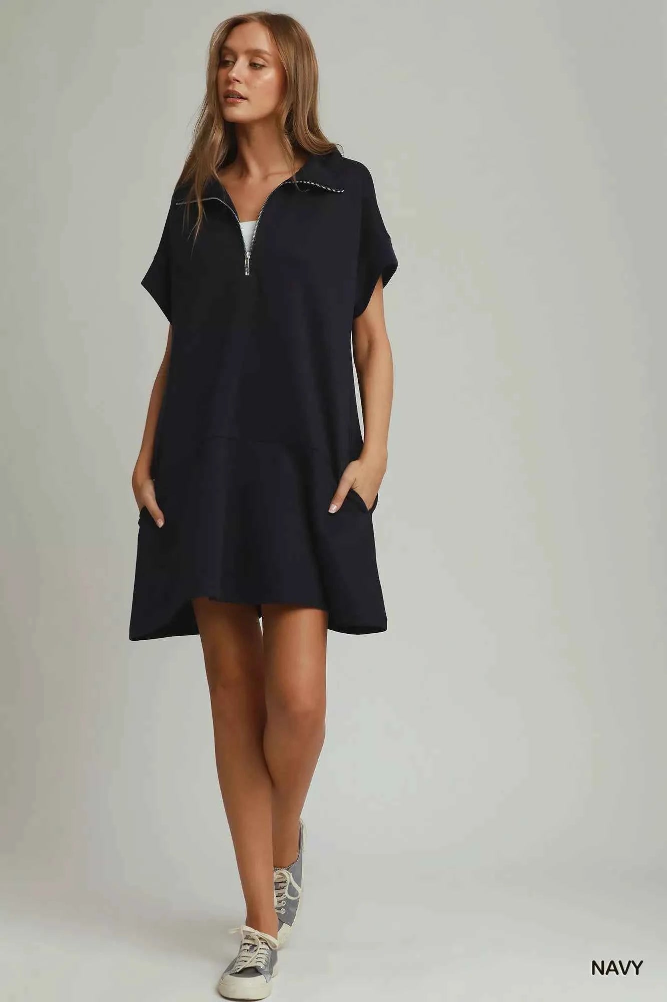 Umgee navy CloudKnit quarter zip mini dress with collar, relaxed fit, side pockets, and soft modal blend fabric styled with casual sneakers. full view