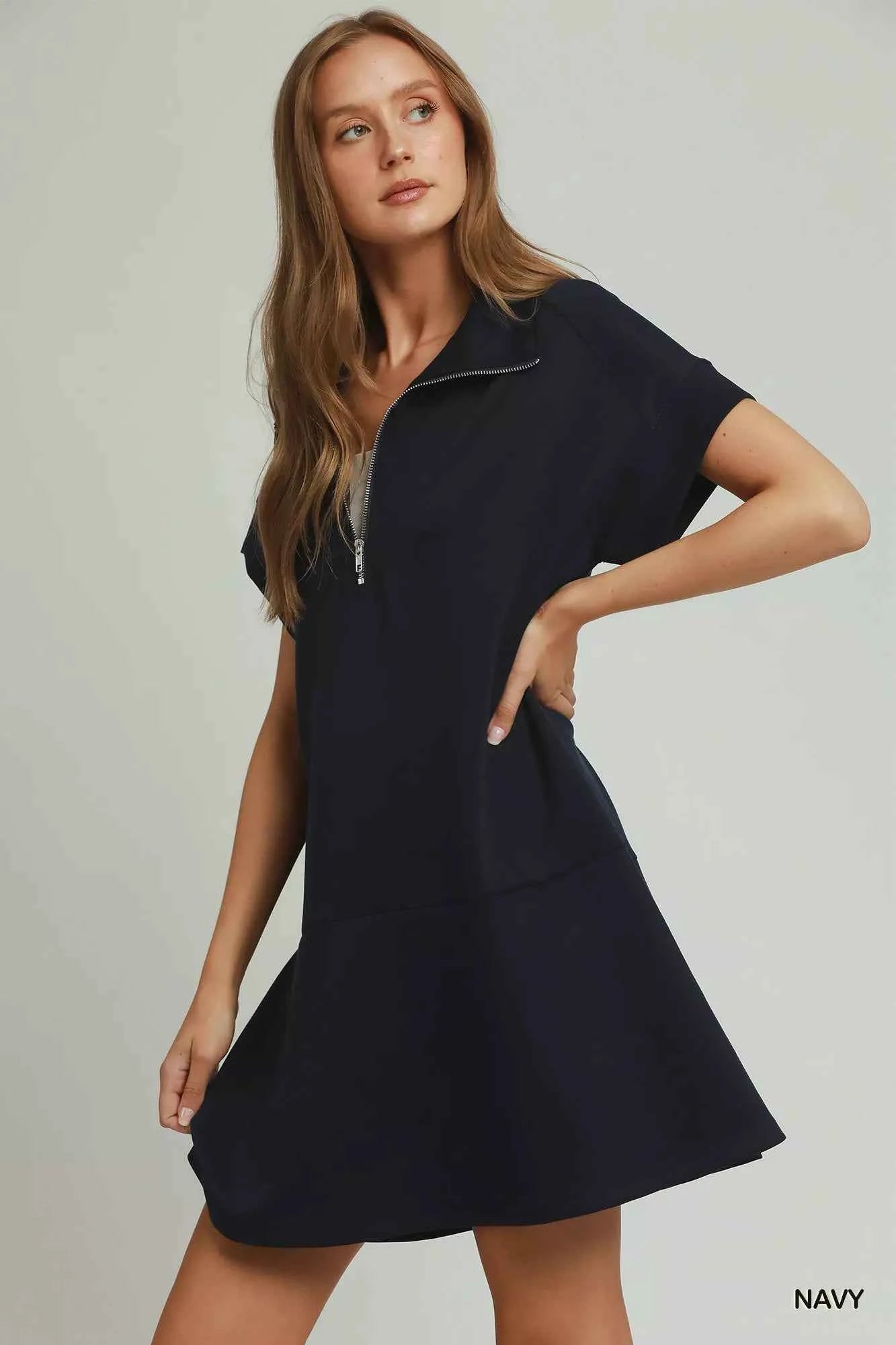 Umgee navy CloudKnit quarter zip mini dress with collar, relaxed fit, side pockets, and soft modal blend fabric styled with casual sneakers. Side View