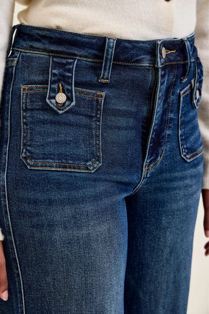 Woman wearing Judy Blue Lux high waist retro wide leg jeans in dark indigo wash with front patch pockets and a vintage-inspired silhouette. Pocket View