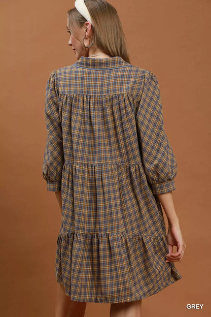 Woman wearing Umgee Grey Plaid Oversized Shirt Dress with button-front closure, chest pocket, collared neckline, and relaxed fit. Back View