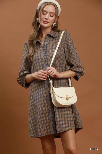 Woman wearing Umgee Grey Plaid Oversized Shirt Dress with button-front closure, chest pocket, collared neckline, and relaxed fit. Front View