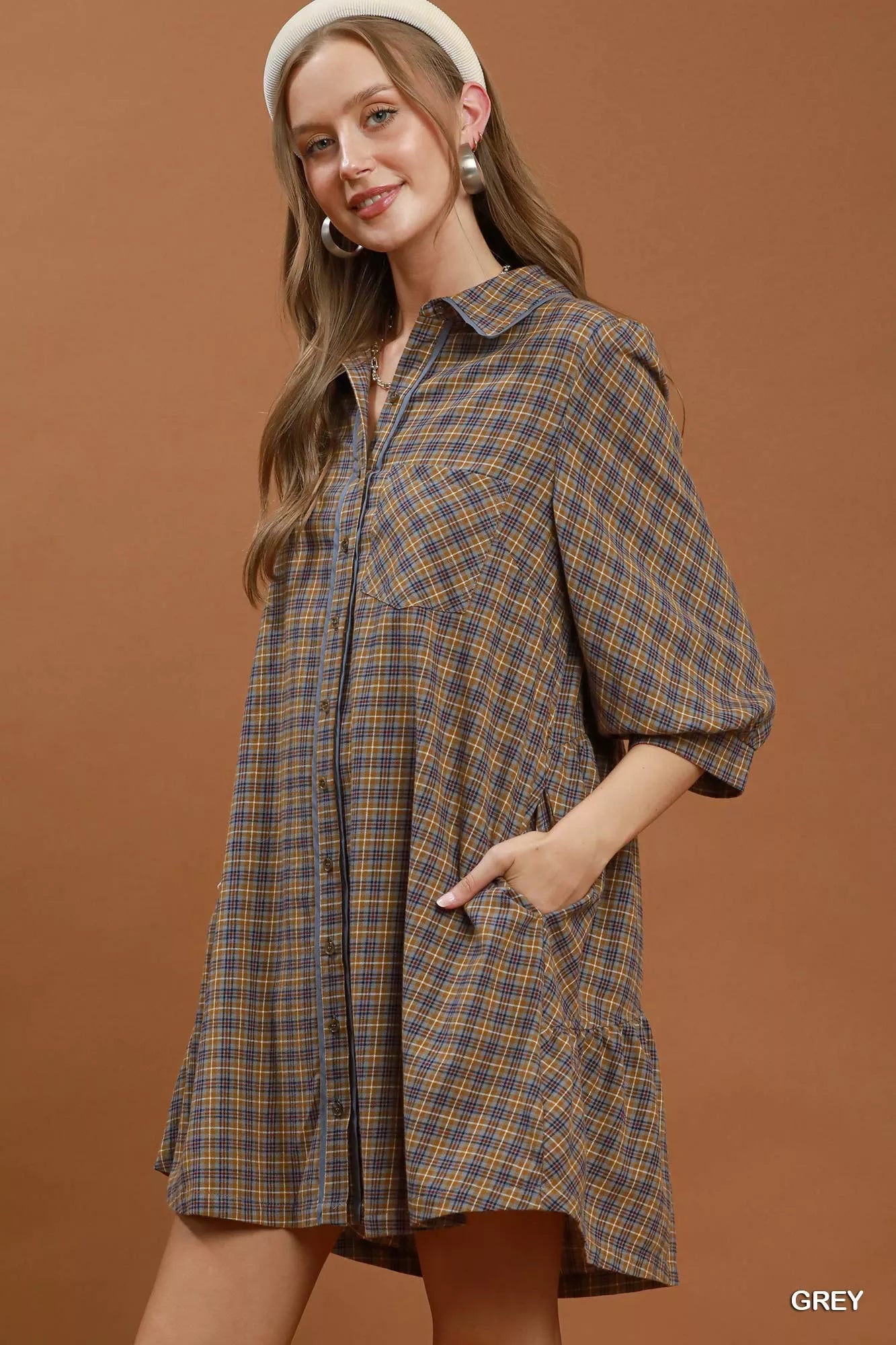 Woman wearing Umgee Grey Plaid Oversized Shirt Dress with button-front closure, chest pocket, collared neckline, and relaxed fit. Side View