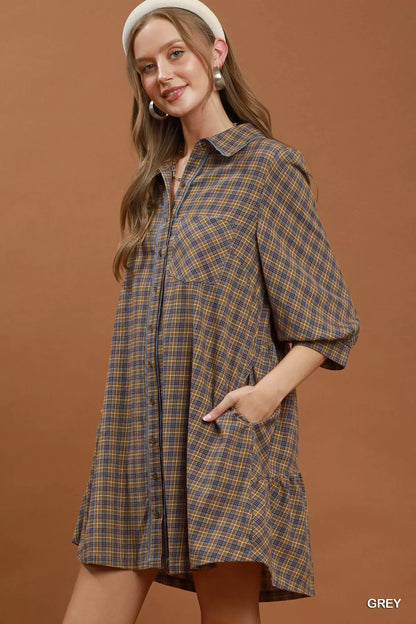 Woman wearing Umgee Grey Plaid Oversized Shirt Dress with button-front closure, chest pocket, collared neckline, and relaxed fit. Side View