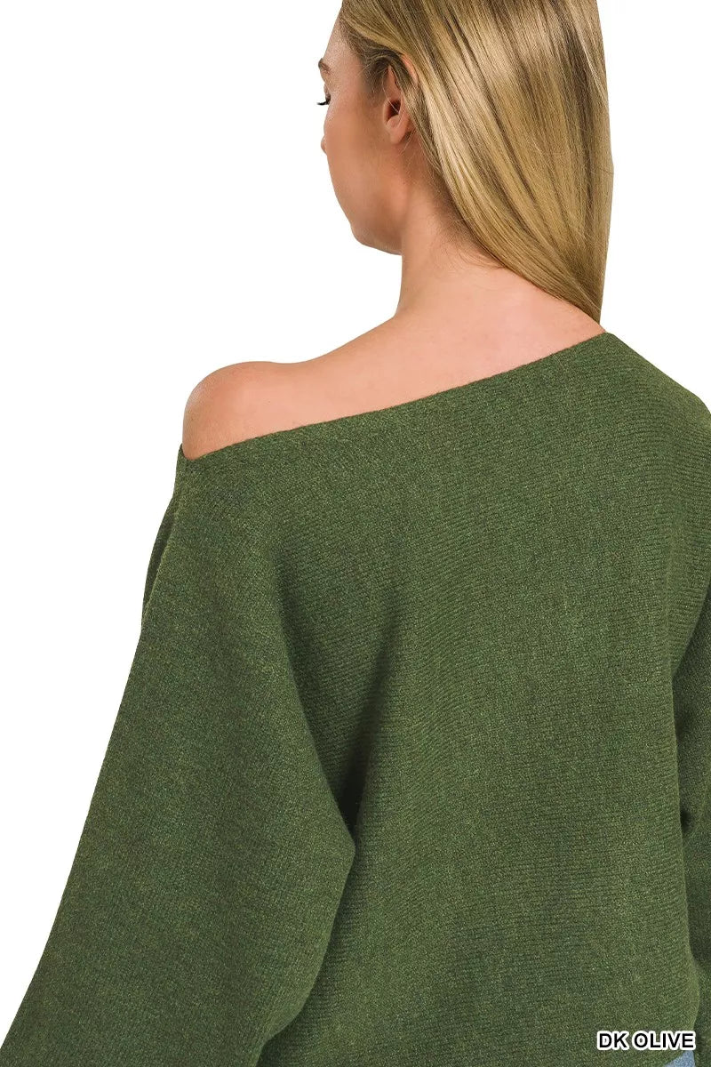Woman wearing Zenana Dark Olive Boat Neck Balloon Sleeve Sweater with oversized fit and ribbed cuffs paired with denim jeans. Back View 2