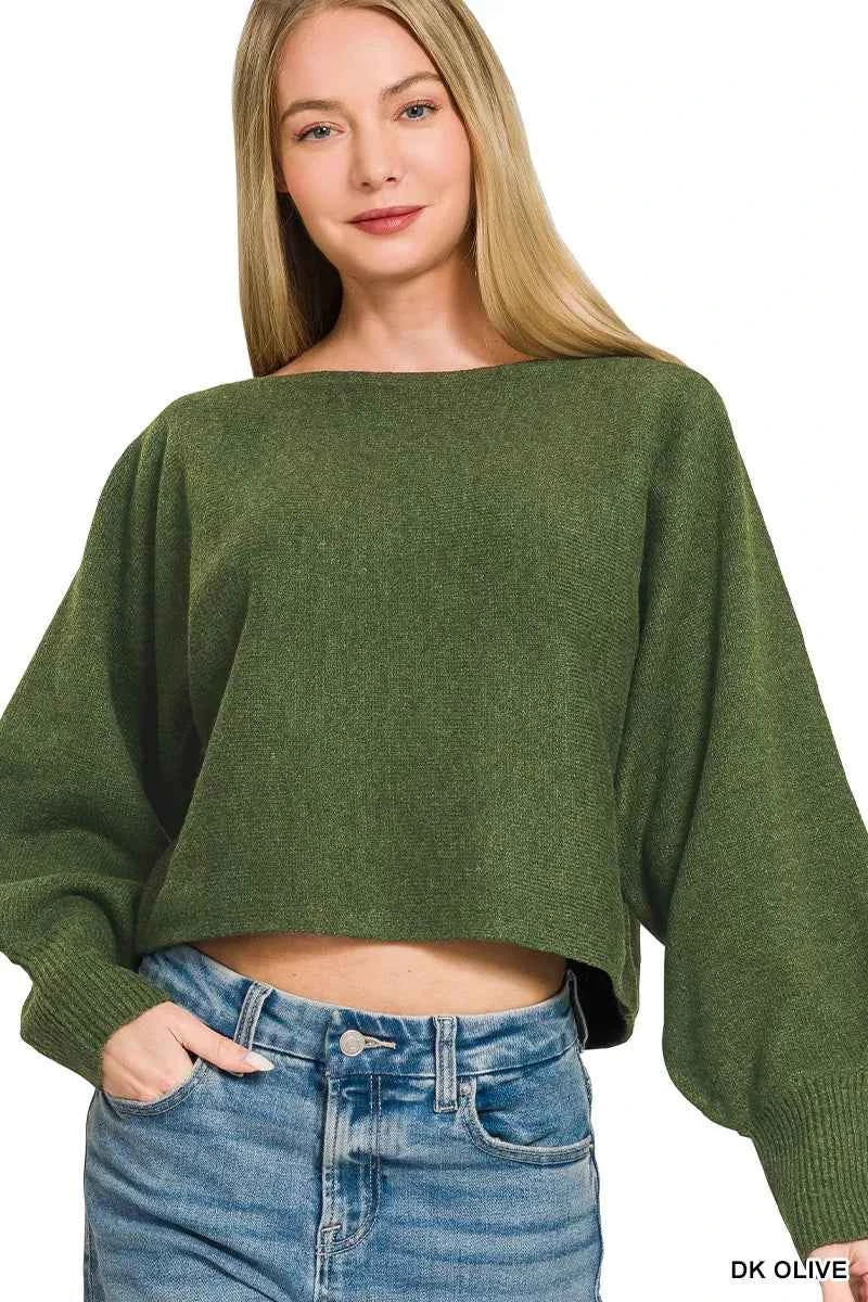 Woman wearing Zenana Dark Olive Boat Neck Balloon Sleeve Sweater with oversized fit and ribbed cuffs paired with denim jeans. Front View 2