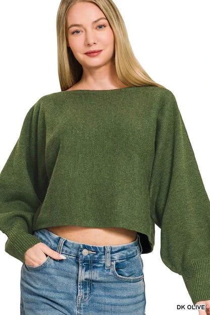 Woman wearing Zenana Dark Olive Boat Neck Balloon Sleeve Sweater with oversized fit and ribbed cuffs paired with denim jeans. Front View 2