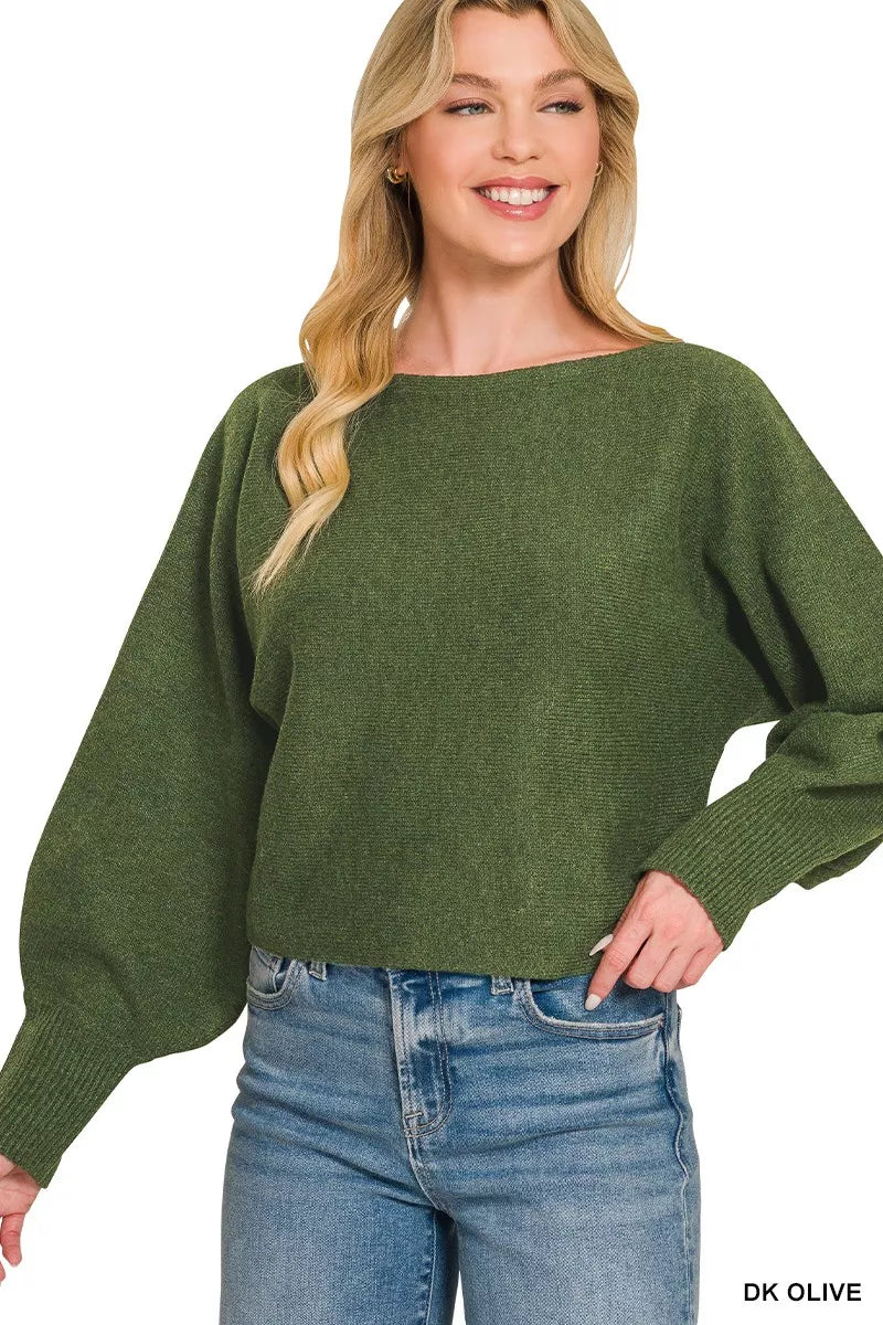 Woman wearing Zenana Dark Olive Boat Neck Balloon Sleeve Sweater with oversized fit and ribbed cuffs paired with denim jeans. Front View 3