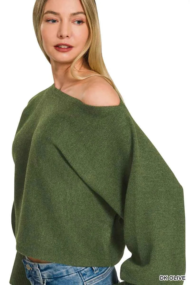 Woman wearing Zenana Dark Olive Boat Neck Balloon Sleeve Sweater with oversized fit and ribbed cuffs paired with denim jeans. Side View