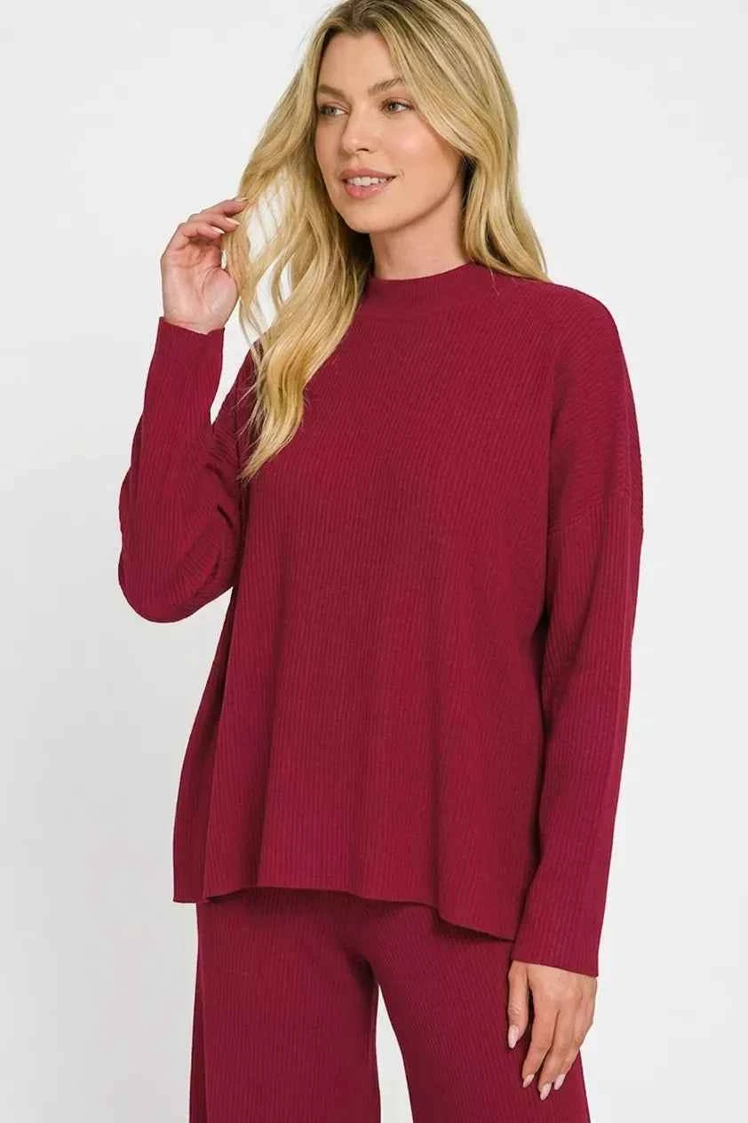 Woman wearing a Cabernet ribbed viscose two-piece lounge set featuring a relaxed sweater top and wide-leg pants by Zenana. close view