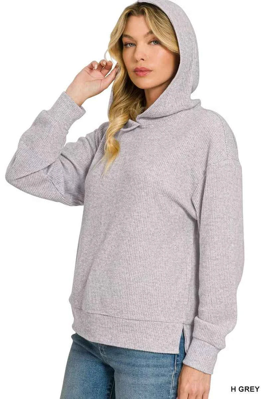 Woman wearing a Heather Grey brushed ribbed hacci knit hoodie with long sleeves and a relaxed fit by Zenana. Side View
