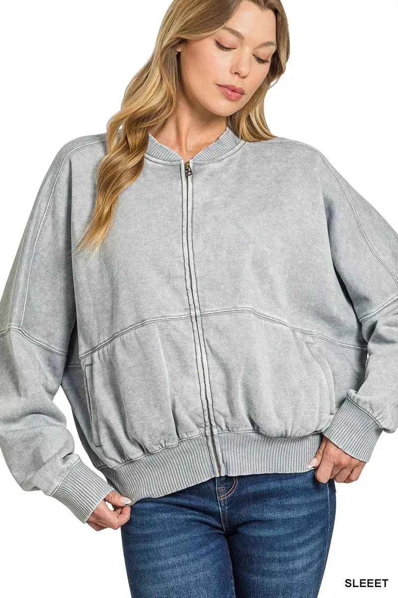 Woman wearing a Sleet acid wash fleece bomber jacket by Zenana featuring a relaxed fit, ribbed trim, zip front and soft vintage washed finish. Front View 2