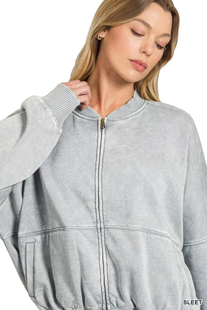 Woman wearing a Sleet acid wash fleece bomber jacket by Zenana featuring a relaxed fit, ribbed trim, zip front and soft vintage washed finish. Front view 3