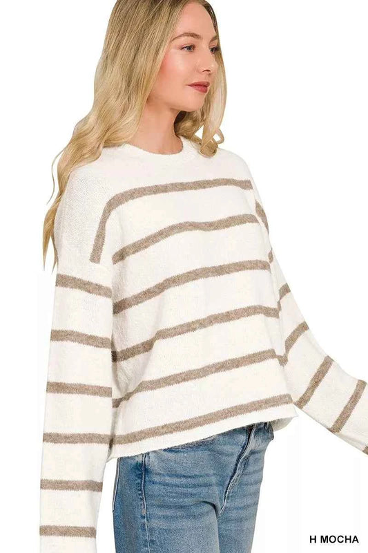 Woman wearing a Zenana Heather Mocha striped wool blend sweater with long sleeves and a relaxed fit. side View
