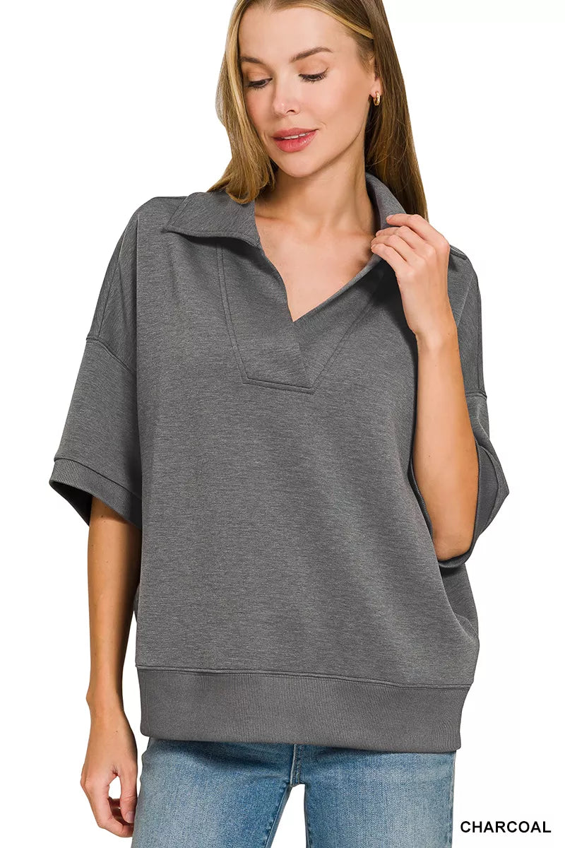 Woman wearing a Zenana charcoal scuba knit two-piece set featuring a collared short-sleeve pullover top and matching wide-leg pants with pockets.