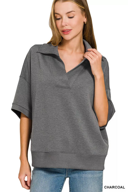 Woman wearing a Zenana charcoal scuba knit two-piece set featuring a collared short-sleeve pullover top and matching wide-leg pants with pockets.