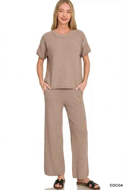 Woman wearing a Zenana cocoa ribbed knit two-piece lounge set featuring a relaxed short-sleeve top and matching wide-leg pants. front view 2